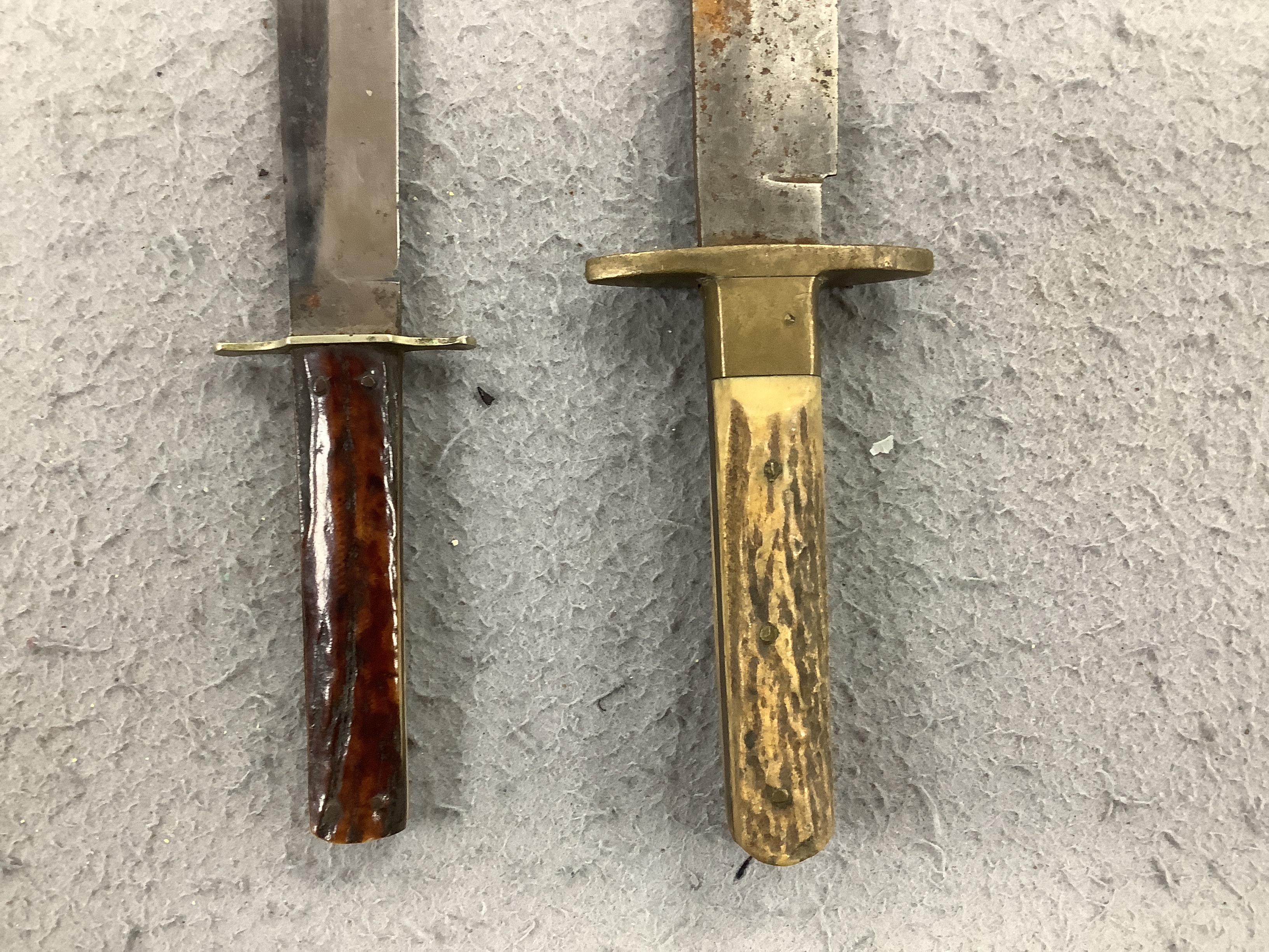 Two antler-handled hunting knives and three other knives